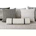 Contemporary Sofa Pillows with Textured Knit and Striped Patterns in Neutral Hues