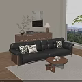 Black Leather Sofa and Round Wooden Coffee Table Set with Patterned Pillows and Books