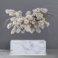 Dried White Flowers in Cube Shaped Marble Vase Against Gray Wall Background