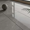 Gray Marble Tile Floor With Sphere And Green Plant Leaves Under Window Light