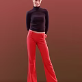Woman in Black Turtleneck Top and Red Pants Standing Against Red Background