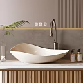 Modern Minimalist Bathroom Vanity With White Curved Washbasin Brass Faucet Soap Bottles And Green Plant
