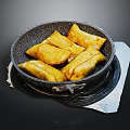 Golden Crispy Fried Dumplings in Black Stone Pan on Stove Top