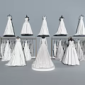 Elegant White Wedding Dresses With Lace Details Displayed On Hangers And Mannequins