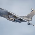 Military Fighter Jet With Four Engines Wide Wings And Landing Gear On Runway