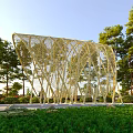 Artistic Pergola Design With Woven Vine Like Structure And Green Tree Surroundings