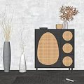 Black Console Cabinet With Rattan Door Panels Decorative Vases And Dried Flowers In Entryway