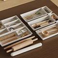 Organized Utensil Set With Wooden Metal Kitchen Tools In White Storage Trays On Brown Tabletop