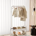 White Metal Clothes Rack with Hanging Light Colored Clothes and Storage Shelf for Home Bedroom