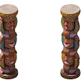 Two Colorful Traditional Totem Poles With Carved Human Faces And Ornate Tops