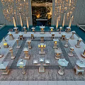Neatly Arranged Stone Lanterns As Garden Ornaments With Water Features And Decorative Wall