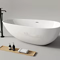 Modern Freestanding White Oval Bathtub With Black Faucet Wooden Tray Bath Products And Towels