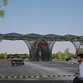 Modern Architectural Entrance Gate With Arched Metal Framework And Surrounded by Vehicles Pedestrians Green Trees