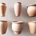 Ceramic Vessels Featuring Textured Surfaces And Various Shapes In Natural Tones For Decor