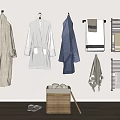 Bath Robes And Towels Hanging On Wall With Wicker Basket And Slippers