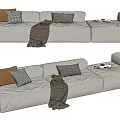 Modern Light Gray Sectional Sofa With Brown Checkered Pillows Knitted Throw Blanket And Magazines