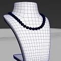 Elegant Pearl Necklace On White Jewelry Display Stand With White Countertop And Gray Background