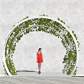 Outdoor White Arched Pergola Covered With Green Vines And Woman Standing Under