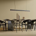 Modern Dining Table And Black Chairs Set With Hanging Pendant Light And Decorative Items