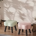 Light Green And Pink Accent Chairs With Black Spherical Legs On Wooden Floor