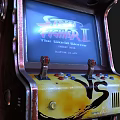 Vintage Yellow Black Arcade Amusement Equipment with VS Lettering and Top Buttons
