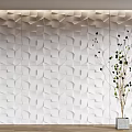 White 3D Geometric Pattern Wall Panels With Decorative Green Plant In Modern Interior 3d model