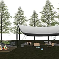 White Outdoor Tent Setup With Trees Grass Picnic Mat Food Drinks And Chairs