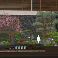 Zen Inspired Courtyard Garden With Wooden Deck Pink Cherry Blossom Tree And Rocky Stone Wall