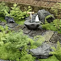 Stepping Stones Path In Japanese Garden With Green Plants Moss Rocks And Lantern