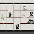 Modern Bookshelf With Black Frame Orange Shelves Art Figures Potted Plant And Books