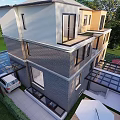 Modern Two Story Detached House Exterior With Large Windows Green Courtyard And Glass Roof
