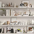 Decorative Ornament Set on Multi Layered Shelves with Books Vases Sculptures and Green Plants