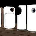 White Electronic Devices With Various Shapes And Circular Openings On Wooden Surface