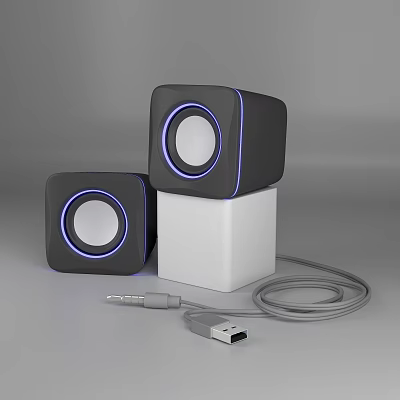 Black Cube Shaped Speakers with Blue Ring Lights on White Cube Base and USB Cable 3d model
