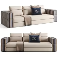 Stylish Beige Sectional Sofa With Striped Armrests Decorative Pillows And Throw Blanket