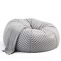 Comfortable Beige Bean Bag Chair With Gray Blanket For Cozy Living Room