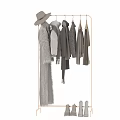Neutral Tones Clothes Collection Featuring Knit Sweaters Fur Coats Scarves And Boots On Hanging Display Racks