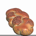 Freshly Baked Golden Braided Bread Topped With Sesame Seeds On Black Background