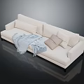 Minimalist Beige Sectional Sofa With Light Blue Blanket Decorative Pillows And Black Legs