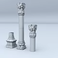 Three Decorative Columns of Different Heights with Ornate Carvings and Intricate Bases and Detailed Capitals