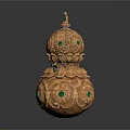 Golden Gourd Shaped Sculpture Featuring Intricate Patterns Green Gemstones And Decorative Details