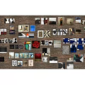 Brick Wall Decorated With Various Photos Artworks And Decorative Items