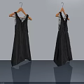 Black Lace Dresses Hanging On Hangers Against White Wall And Gray Floor