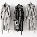 Long Hooded Coats in Gray and Black Hanging on Hangers with Plush Fabric