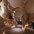 Unique Restaurant Interior Design With Cave Like Ceiling Blue Art Bar Counter And Black Stools