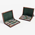 Two Open Wooden Cases With Green Interiors And Colorful Items Inside