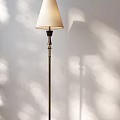 Floor Lamp With White Lampshade And Metal Stand On White Wall With Sunlight Shadow Effects