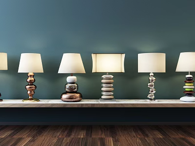 Unique Shaped Table Lamps With Stacked Colored Bases White Shades On Shelf Against Teal Wall 3d model