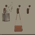 Brown Wall Hooks On Beige Wall With Checkered Bag Plants And Brown Bag
