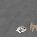 Modern Textured Gray Floor Tiles in Interior Space with Open Magazine and Small Lion Decor